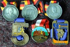 Finishermedalien von 2 x Berlin-, Kln- und Hamburg-Marathon